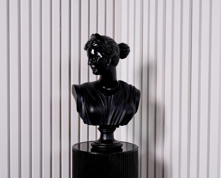 Modern photo studio with accent walls and Judy Black Bust statue CB2