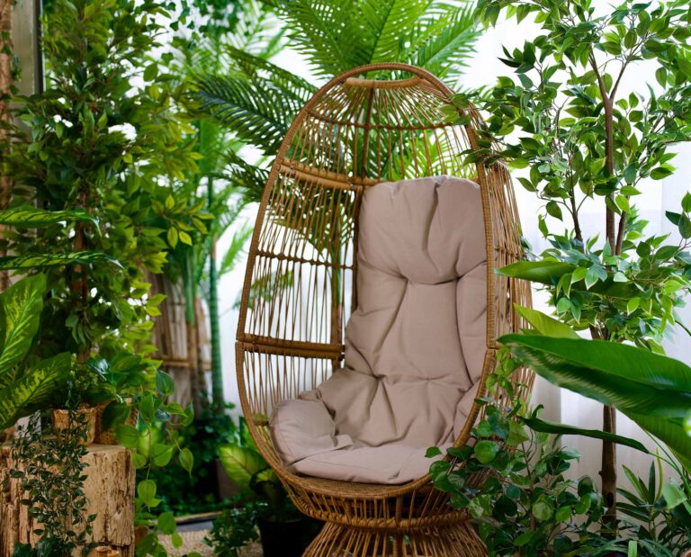 Egg chair aesthetic with green plants filling the space. Unique and affordable photography studio in Toronto.