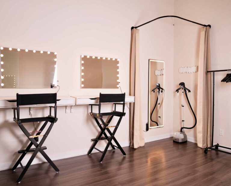 Multi-set photo studio with makeup stations and dressing room.