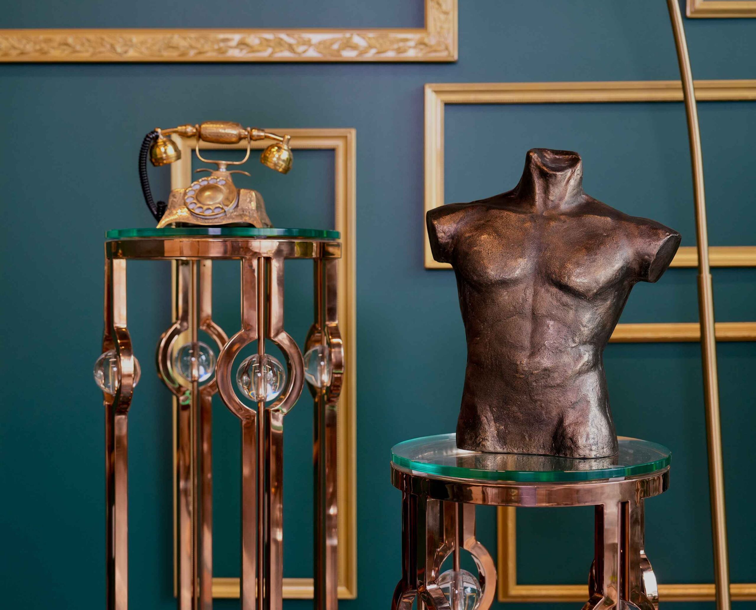 Elegant and luxurious photo studio space in Toronto with pedestals, vintage decor, and Demetri Bust Decor CB2