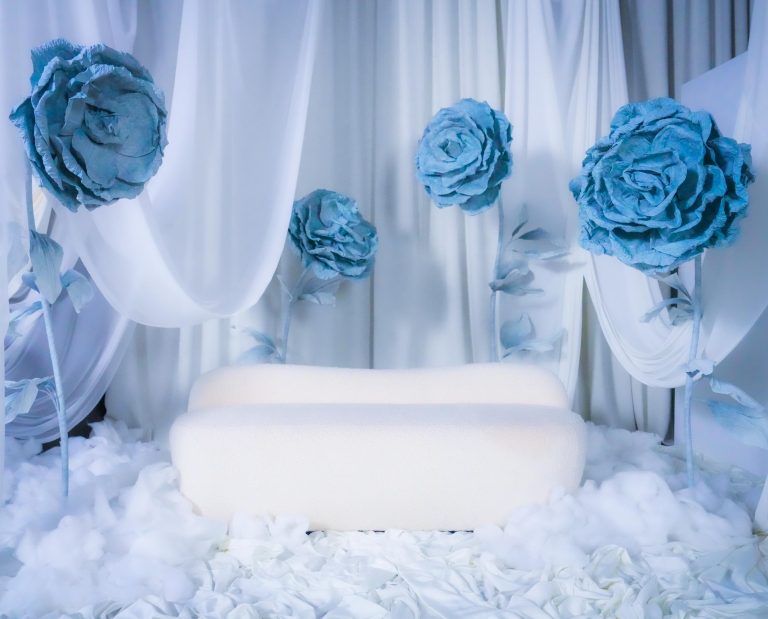 Crystal Garden set at Hadaki Studios featuring a dreamy white and blue theme with giant blue flowers, perfect for photoshoots in Toronto.