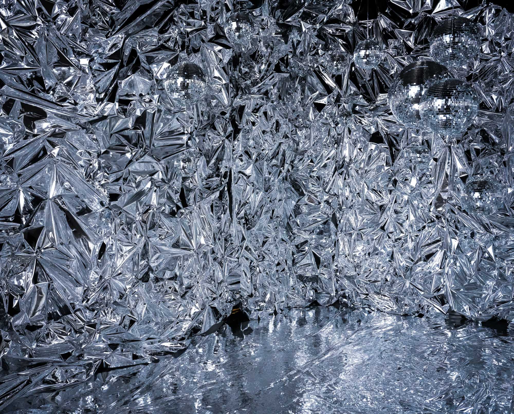 Twinkle Twinkle set at Hadaki Studios featuring reflective mylar walls and shimmering disco balls, creating a futuristic and immersive photography space in Toronto.