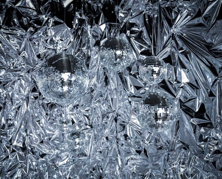 Close-up of disco balls in the Twinkle Twinkle set at Hadaki Studios, surrounded by reflective mylar sheets, perfect for futuristic-themed photoshoots in Toronto.