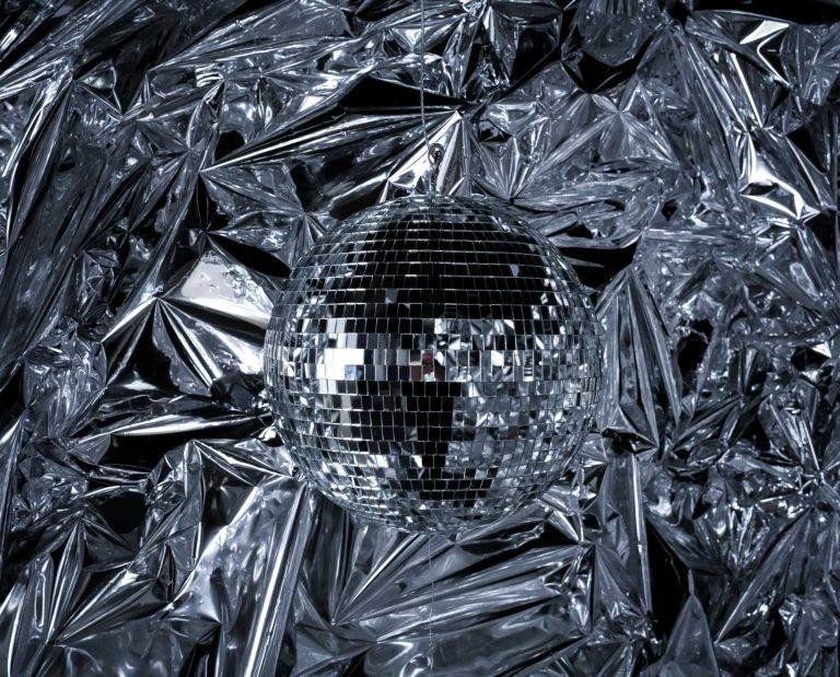 Close-up of a single disco ball in the Twinkle Twinkle set at Hadaki Studios, surrounded by reflective mylar sheets, ideal for futuristic and creative photoshoots in Toronto.